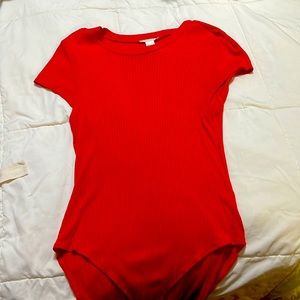 H & M Orange ribbed body suit